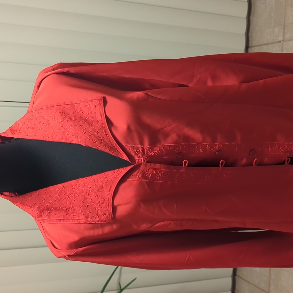 A red polyester women's blouse